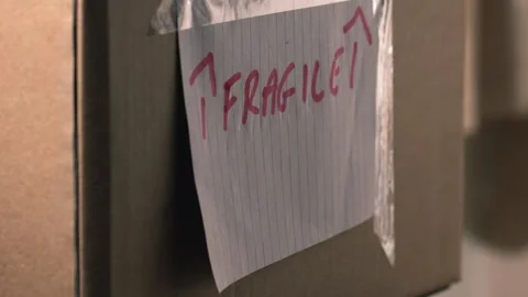 Moving home with cardboard boxes labels close up 스톡 동영상 244635361