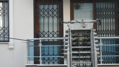 Moving house elevator on outside of apartment during moving house activity. Stock Photos