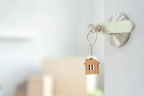 Moving house, relocation. The key was inserted into the door of the new hou.. Stock Photos
