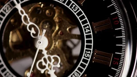 Moving internal clock gears visible behind white decorative hands Video stock 329595566