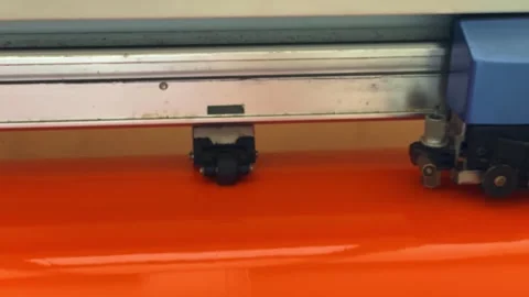 Moving knife unit on sticker cutting machine. Cnc machine cutting and Video stock 255582557