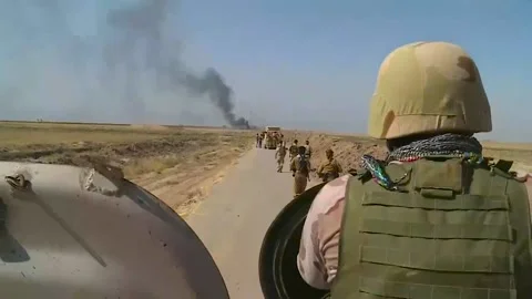 Moving Kurdish peshmerga units and a column of armored vehicles Stock Footage 172158342