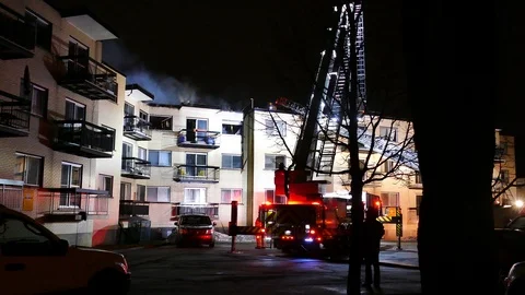 Moving ladder during active apartment fire Stock Footage 114743849