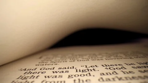 Moving laterally left to right across the first page of the Bible, blank Stock Footage 128964180