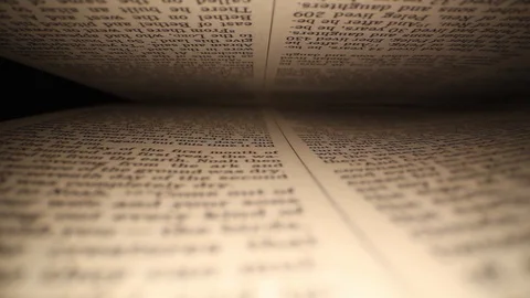 Moving laterally through a book left to right, pages on top &amp; bottom of Stock Footage 116102898