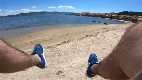 MOVING LEGS IN THE BEACH Stock Footage 92640016