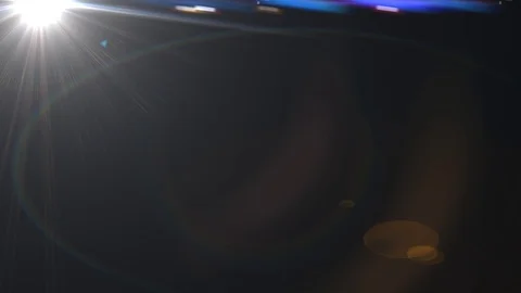 Moving lens flare effect on black backgr... | Stock Video | Pond5