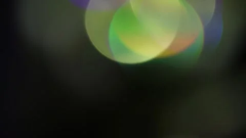 Moving light changing holographic glowing colors from above 库存影片 309970914
