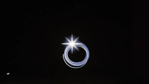 Moving light emitting blue trail in dark studio on faint grid floor, forming Stock Footage 341865140