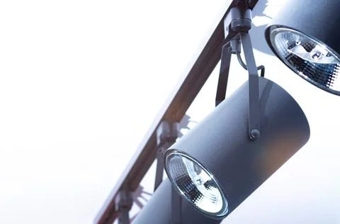 Moving light fixed on the ceiling in the form of a group of lamps Stock Photos