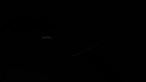 Moving light shining on a cooking knife in the dark Stock Footage 152601504