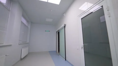 Moving by the long white hall with sinks and mirrors. Medical equipment in the Stock Footage 329931904