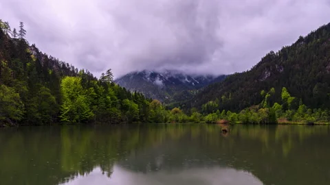 Moving low clouds and fog at a lake timelapse Stock Footage 155567279