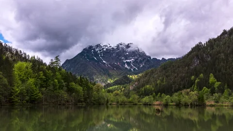 Moving low clouds and fog at a lake timelapse 2 Stock Footage 155567614