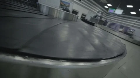 Moving luggage belt with valise in the airport Stock Footage