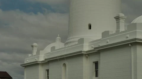 Moving up Macquarie Lighthouse on cloudy day in Sydney 4K Video stock 297839983