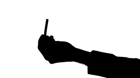Moving male hands pulling a cigarette from a pack Stock Footage 77630240