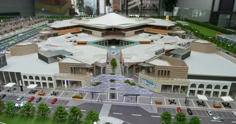 Moving miniature model of a shopping mall with landscape, roads and cars Stock Footage 256146509