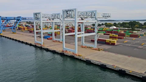 Moving by mostly empty shipping dock-Boston harbor Stock Footage 331331343