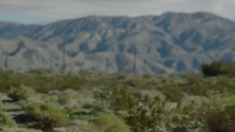 Moving by mountains in the distance Stock Footage 106472714