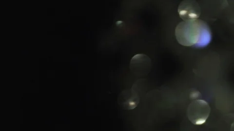 Moving multicolored bokeh in the dark, 4k. Stock Footage 100070426