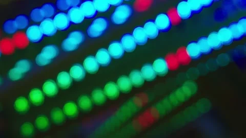 Moving multicoloured lights, defocused light reflections. Looped bokeh 4K. Stock Footage 328143030