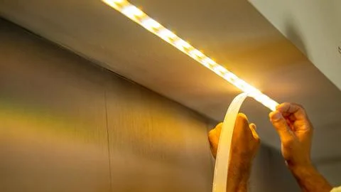 Moving to a new house. Diode lighting installation, how to install led stri.. Stock Photos