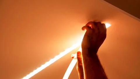 Moving to a new house. Diode lighting installation, installation of LED str.. Stock Photos
