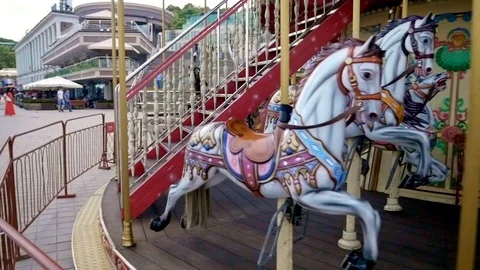 Moving in the opposite direction of carousel Stock Footage 114576680