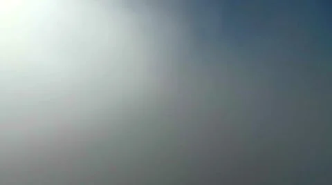 Moving up out of clouds with city skyline Stock Footage 66006865