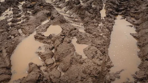 Moving Over Big Tire Tracks In The Mud Stock Footage