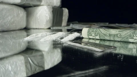 Moving over razor blade and drugs on mirror Stock Footage 100464286