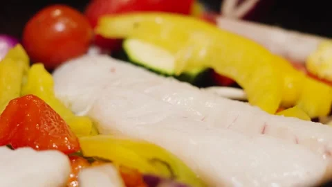 Moving over ready to cook traybake of wild caught atlantic Cod fillets with Stock Footage 328832980