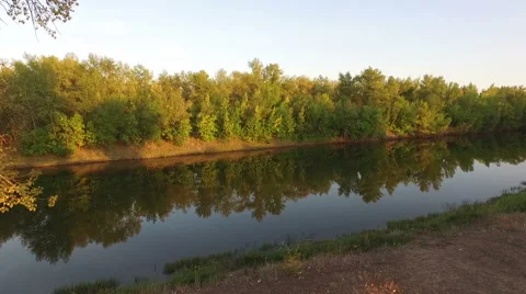 Moving over a river towards trees, Russia Stock Footage 54228079