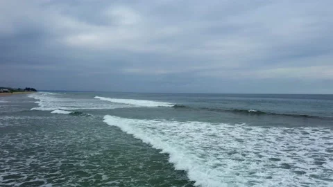 Moving over small waves on a tropical beach in Ecuador Stock Footage 234975900