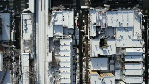 Moving Overhead shot of snowy rooftops in Brooklyn New York Vídeo Stock 168433929