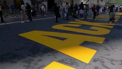 Moving Pan of Black Lives Matter Sign on 5th Avenue in Front of Trump Tower Stock Footage 134853726