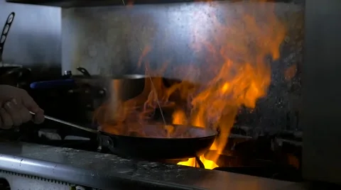 Moving pan on fire in slow motion Stock Footage 64228196