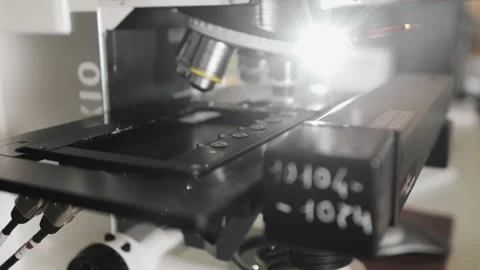 The moving part of a fluorescence microscope. Modern microscope. Stock Footage 294702576