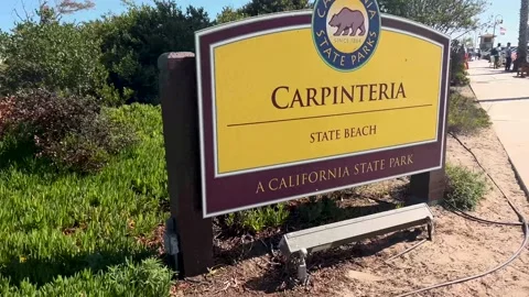 Moving pas the Carpenteria State Beach sign - Real Time Stock-Footage 200020493