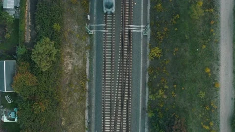Moving passenger train driving through a village in Germany Stock Footage 205001217
