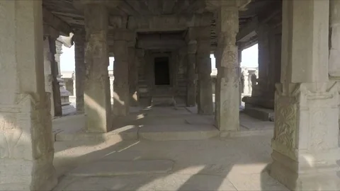Moving past columns in ancient Krishna Temple toward central altar Stock Footage 83469390
