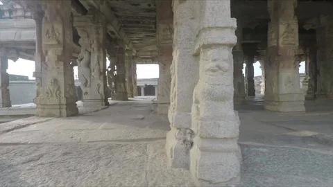 Moving past columns in ancient Krishna Temple, smooth tracking shot, in Hampi Stock Footage 83469391