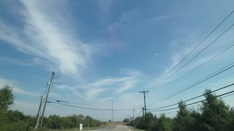 Moving past power lines and cables by road in summer Stock Footage 282812334