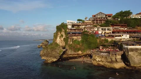 MOVING PAST TOWN ON CLIFF Stock Footage 221300705