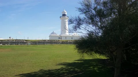 Moving past a tree to Macquarie Lighthouse in Sydney slow motion 4K Stock Footage 155177809