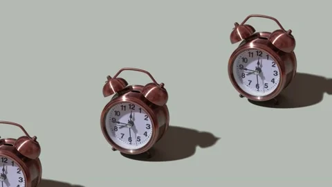 A moving pattern of an alarm clock on an orange background Stock Footage 238762813