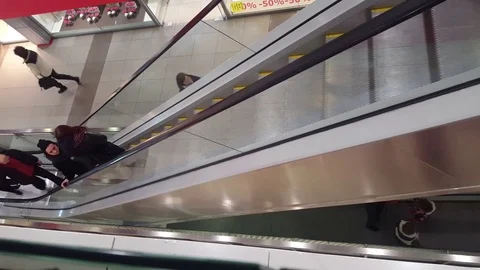 Moving people on an elevator in trade centre Video stock 73777551