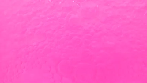 Moving pink bubbles background. Cosmetic micellar cleanser, macro shot. Stock Footage 275075859