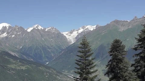 Moving plan of high mountains with snow-covered tops Stock Footage 94077423